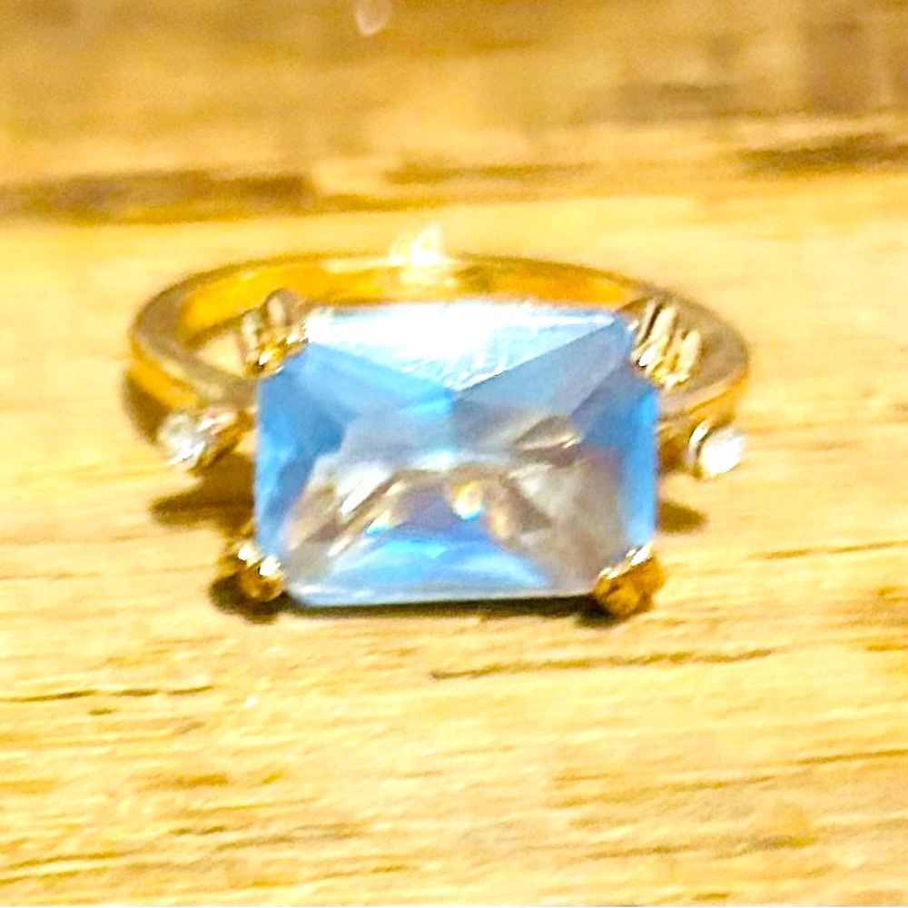 Lab created Blue Topaz and crystal gold tone ring size 10.